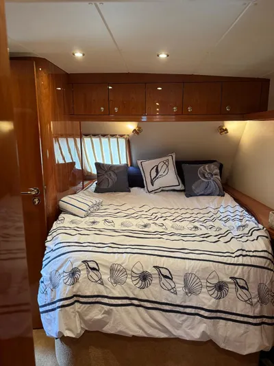 Celaeno Yacht Photos Pics Luxurious bedroom interior of 2007 Elling E3 yacht with elegant bedding and wood finishes.