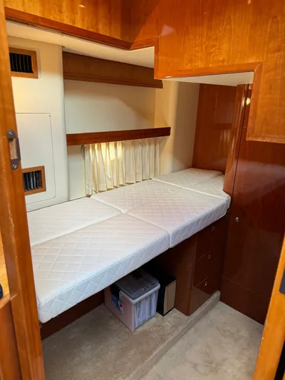 Celaeno Yacht Photos Pics 2007 Elling E3 yacht interior cabin with single bed and wooden cabinetry.
