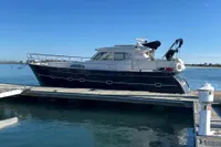 2007 Elling E3 yacht docked at marina under clear blue sky.