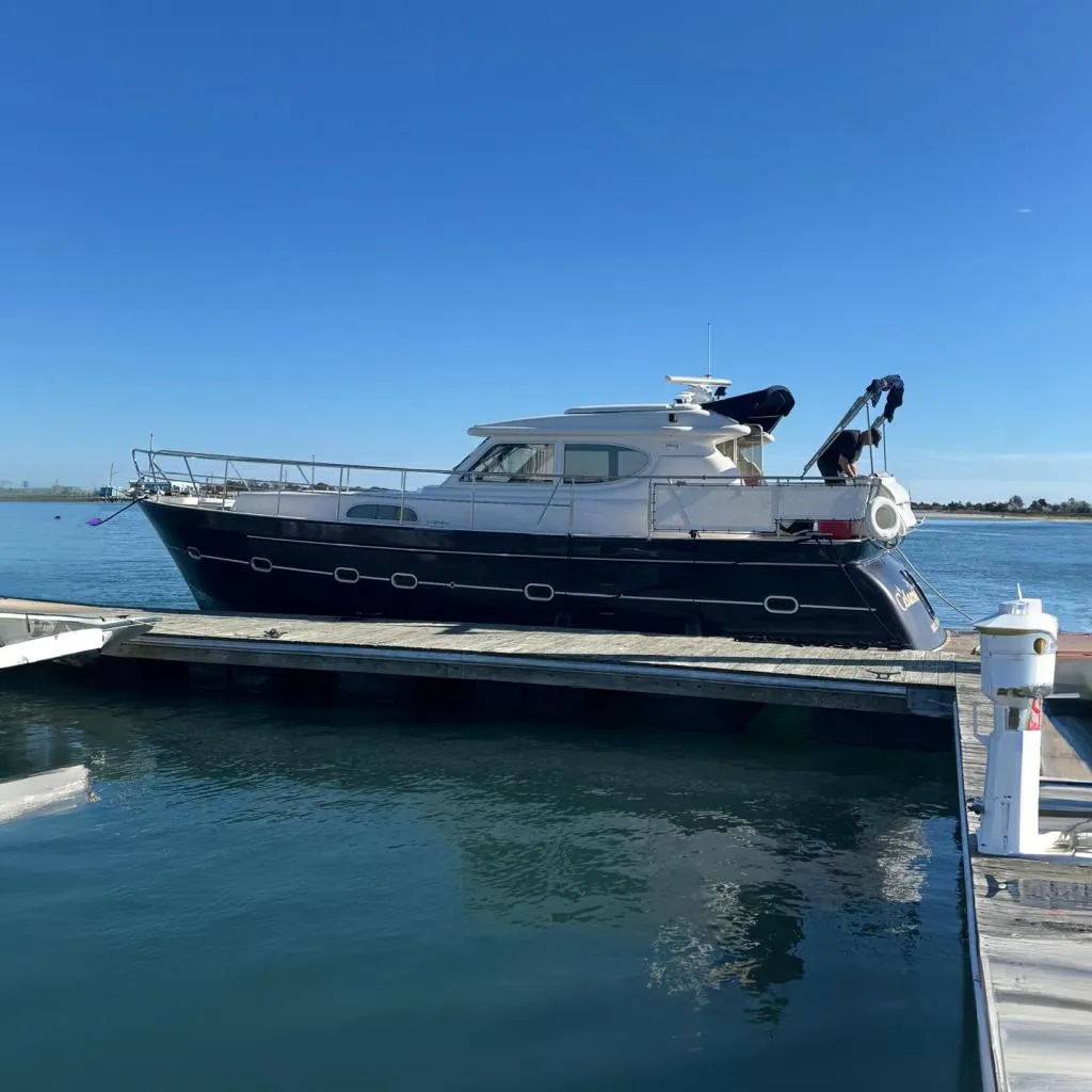 2007 Elling E3 yacht docked at marina under clear blue sky.