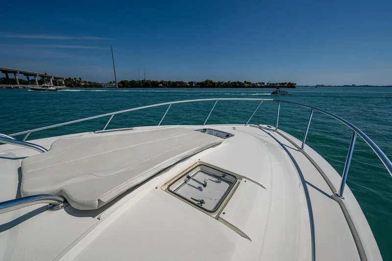 Refit 2018 - Reel Deal Yacht Photos Pics 2012 SeaVee 43 Express boat deck with ocean view and clear blue sky.