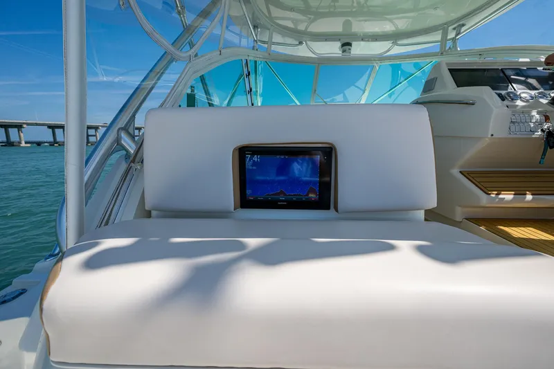 Refit 2018 - Reel Deal Yacht Photos Pics 2012 SeaVee 43 Express boat interior with modern dashboard and seating.