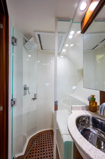 Refit 2018 - Reel Deal Yacht Photos Pics Luxurious bathroom in 2012 SeaVee 43 Express yacht with modern shower and sink.