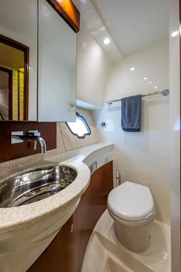 Refit 2018 - Reel Deal Yacht Photos Pics Luxurious bathroom in 2012 SeaVee 43 Express yacht with modern fixtures and elegant design.