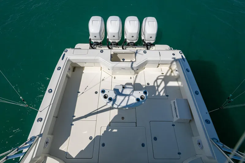 Refit 2018 - Reel Deal Yacht Photos Pics 2012 SeaVee 43 Express boat deck with four outboard engines, viewed from above.