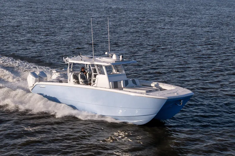  Yacht Photos Pics 2024 Invincible 40 Catamaran cruising on open water, showcasing sleek design and performance.