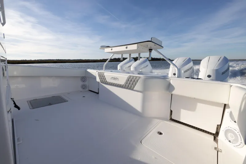  Yacht Photos Pics 2024 Invincible 40 Catamaran with powerful Mercury engines on open water.