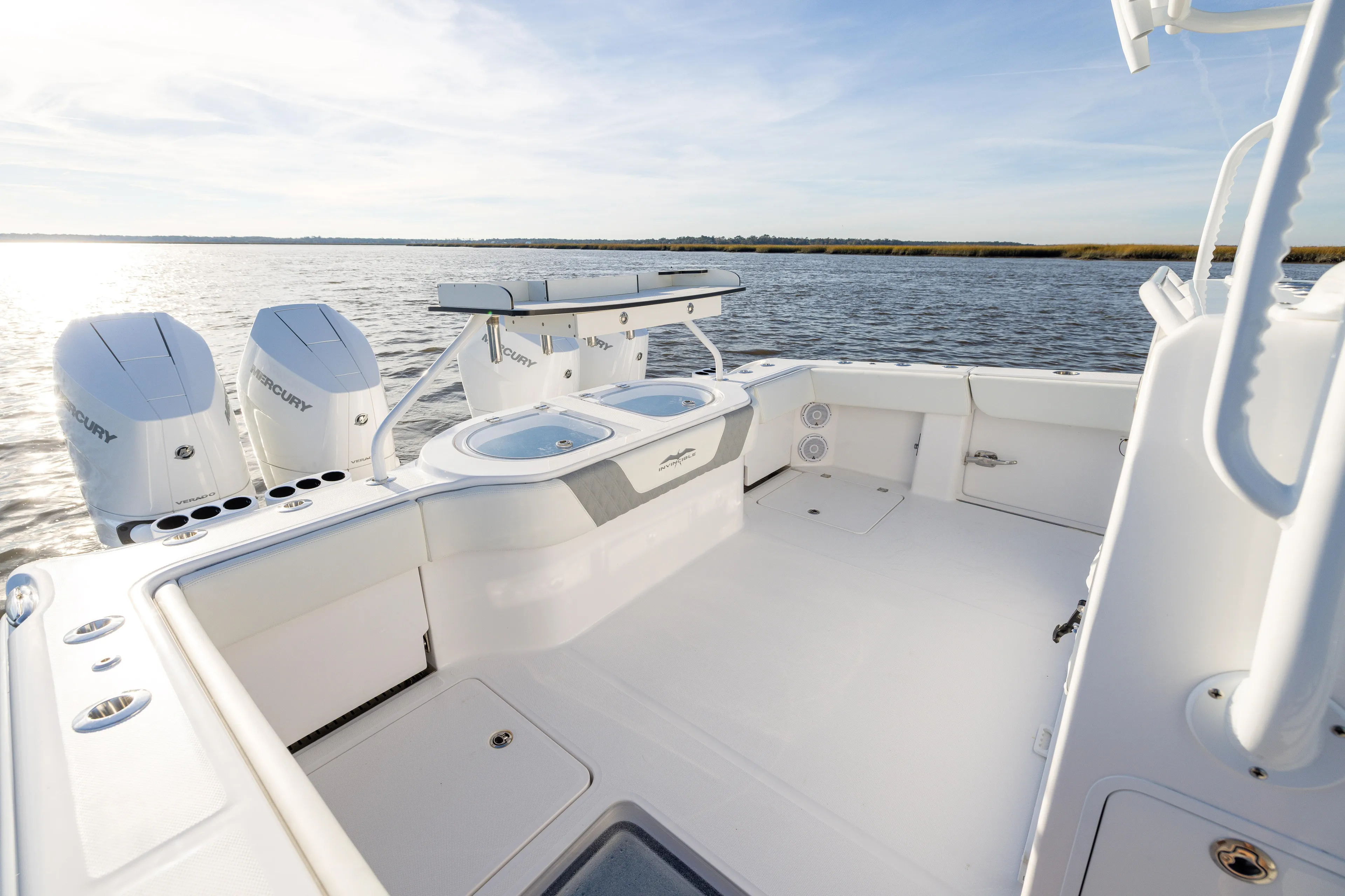  Yacht Photos Pics 2024 Invincible 40 Catamaran with dual Mercury engines on open water.