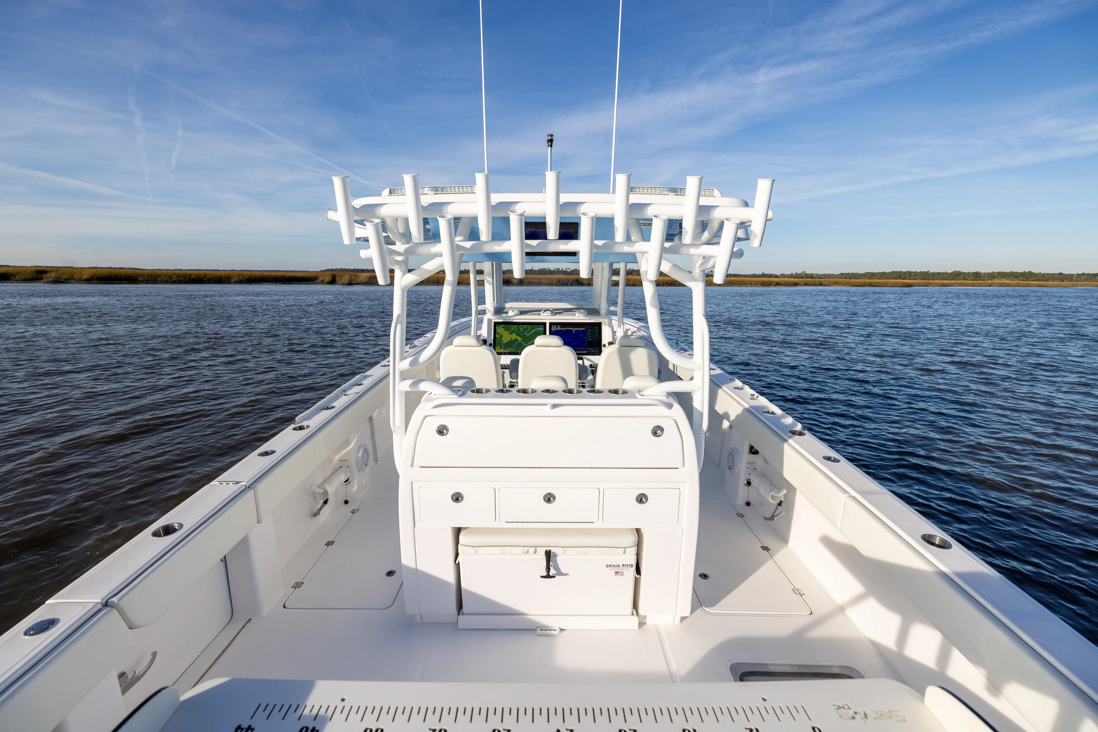  Yacht Photos Pics 2024 Invincible 40 Catamaran on calm water, showcasing spacious deck and modern design.