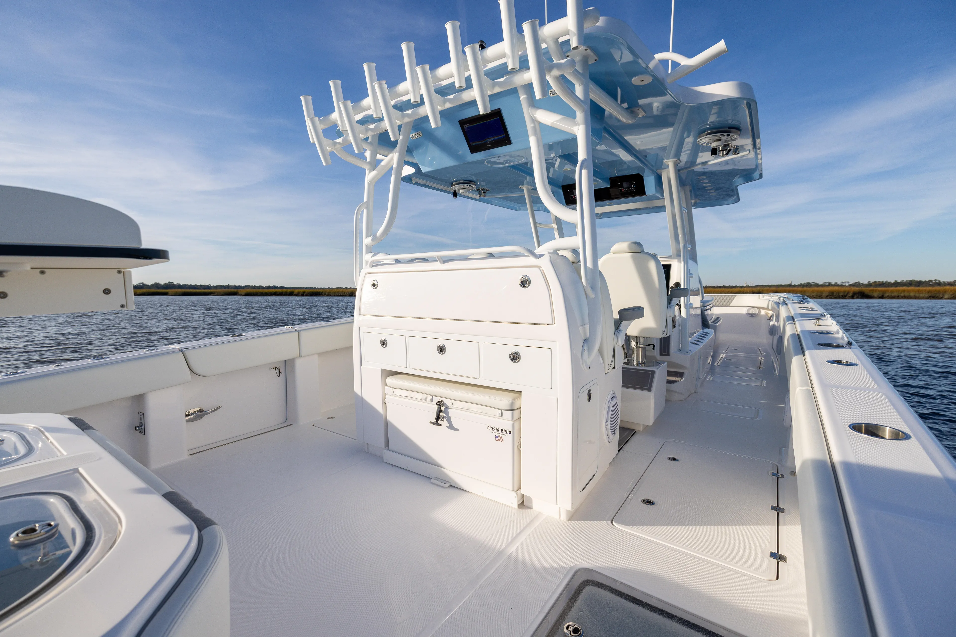  Yacht Photos Pics 2024 Invincible 40 Catamaran on water, showcasing spacious deck and modern design.