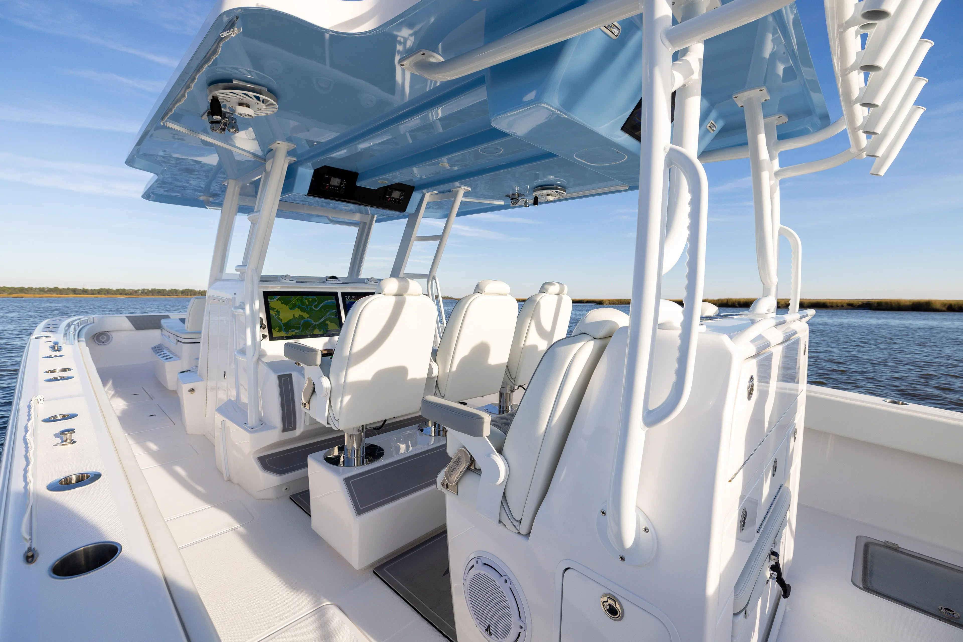  Yacht Photos Pics 2024 Invincible 40 Catamaran interior with modern seating and navigation system on open water.