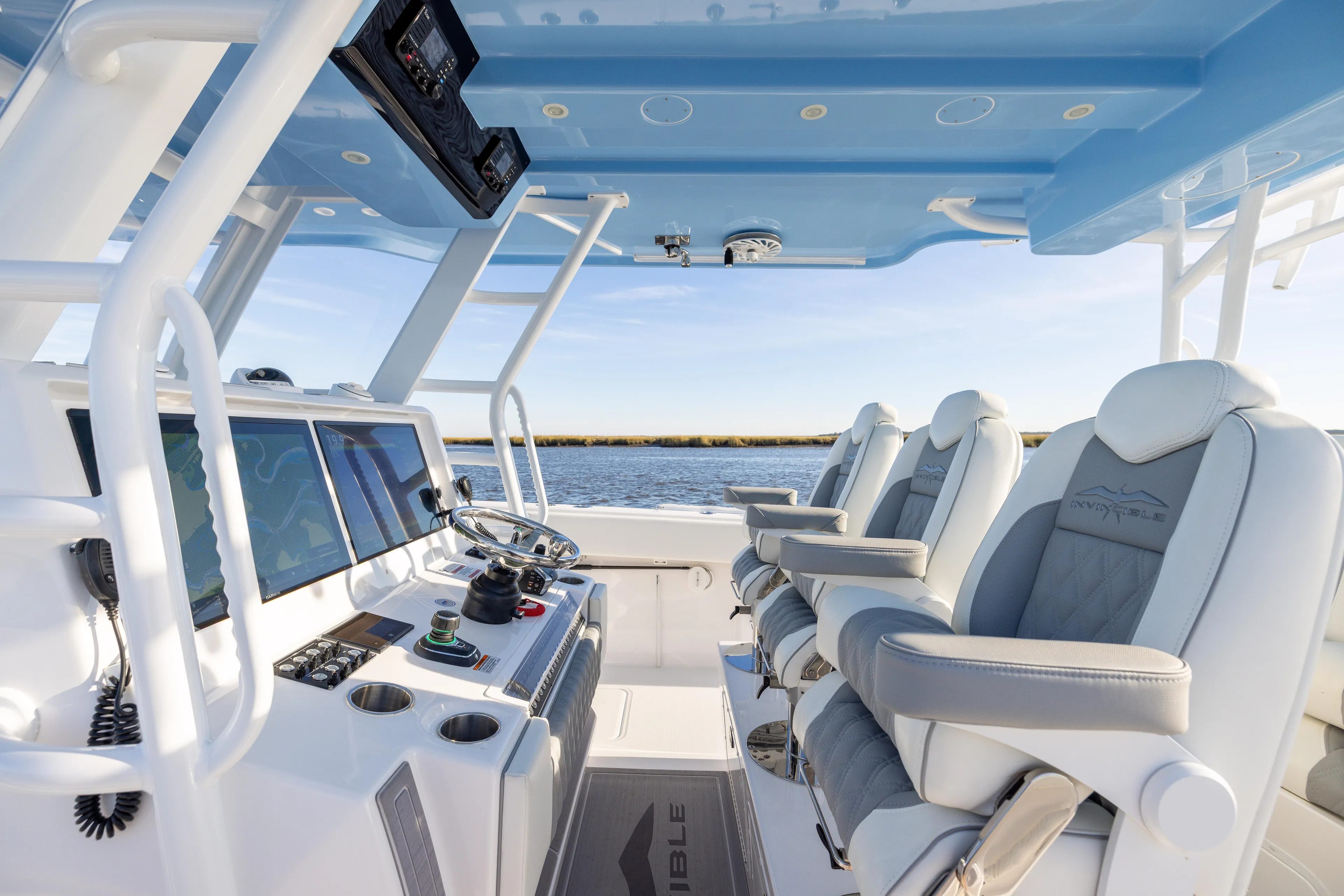 Yacht Photos Pics Interior of 2024 Invincible 40 Catamaran with modern helm and luxurious seating.