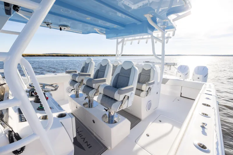  Yacht Photos Pics 2024 Invincible 40 Catamaran interior with luxurious seating and modern controls on open water.