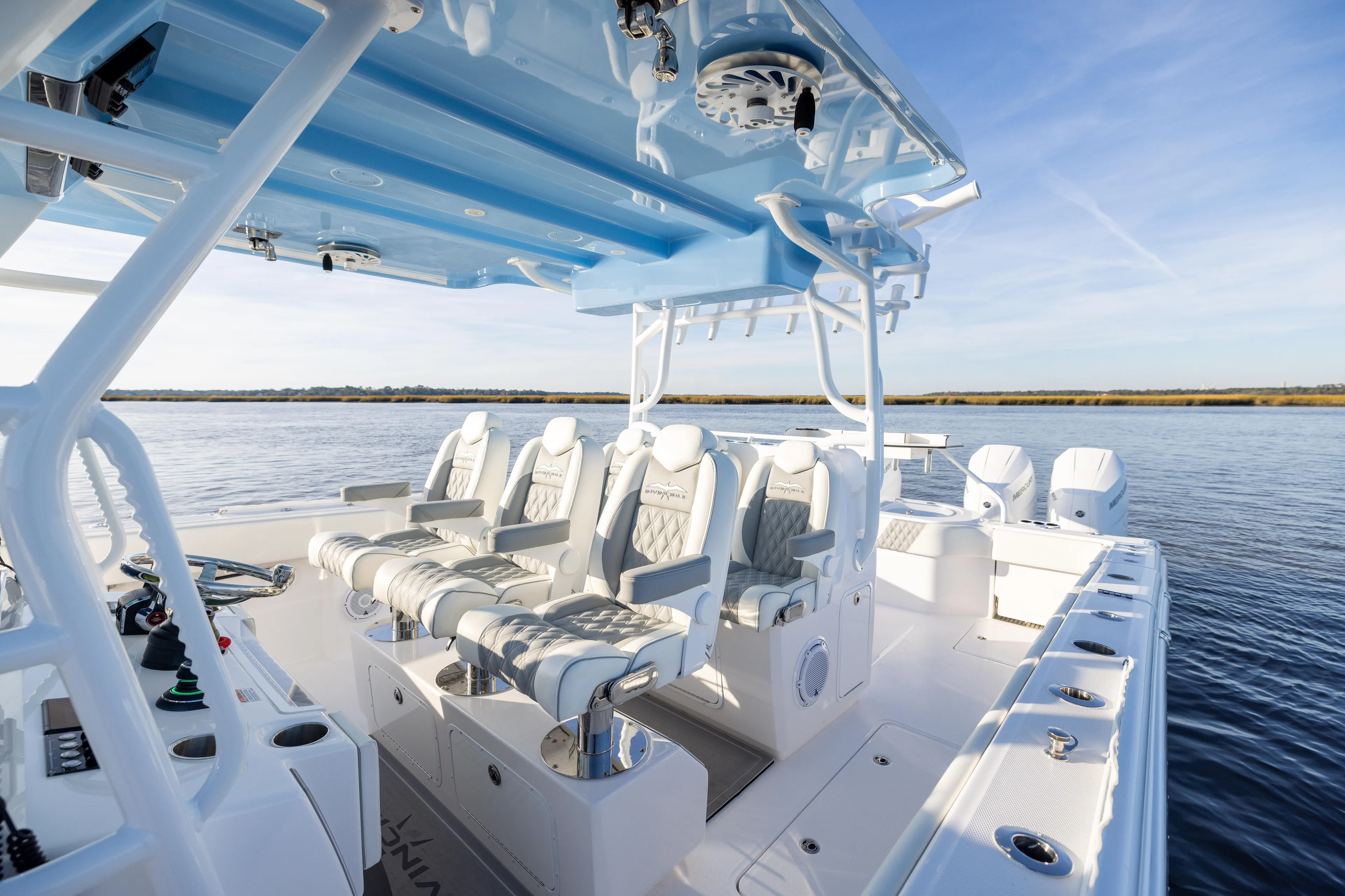  Yacht Photos Pics 2024 Invincible 40 Catamaran interior with luxurious seating on calm waters.