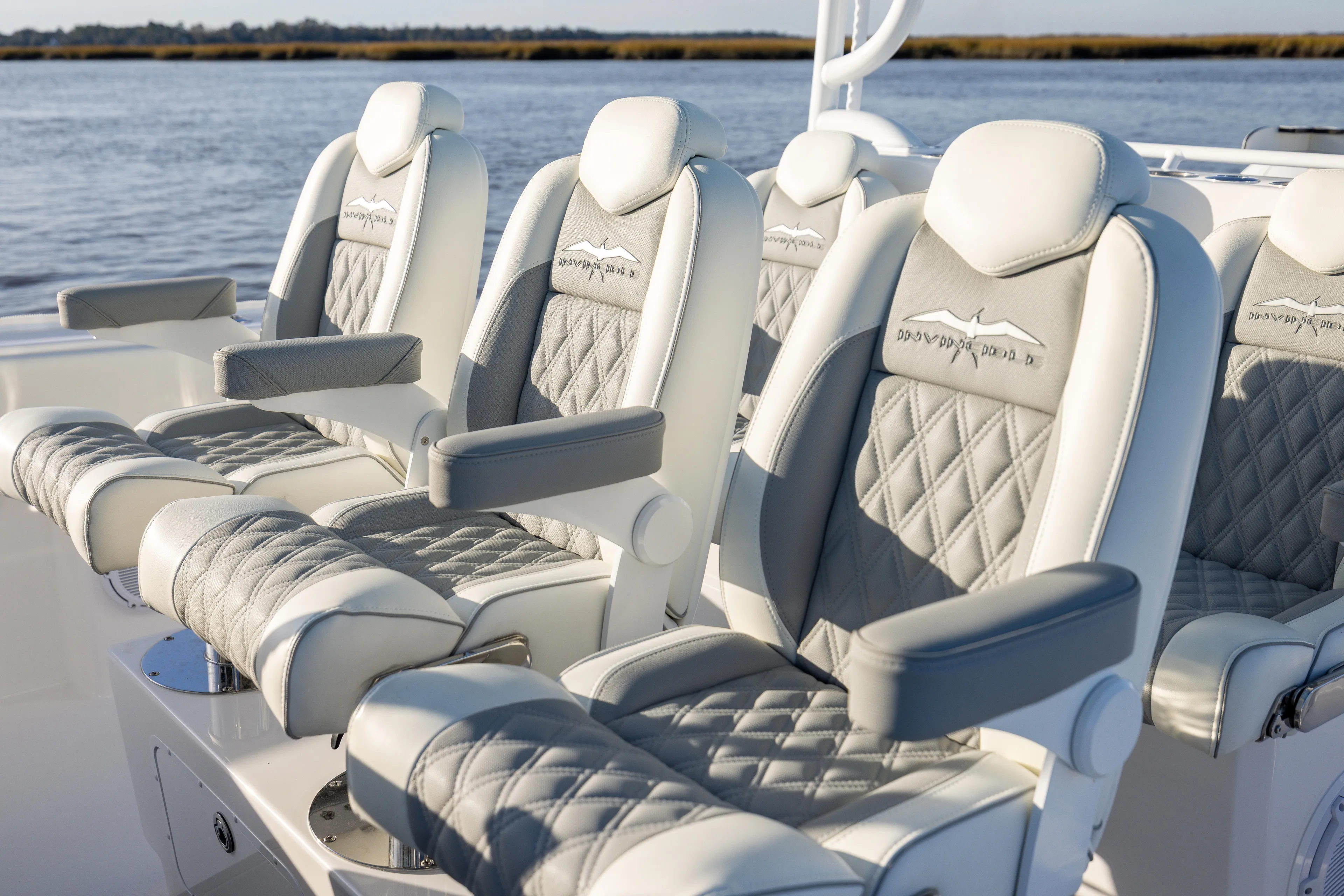  Yacht Photos Pics Luxurious seating on 2024 Invincible 40 Catamaran, featuring elegant diamond-stitched upholstery.