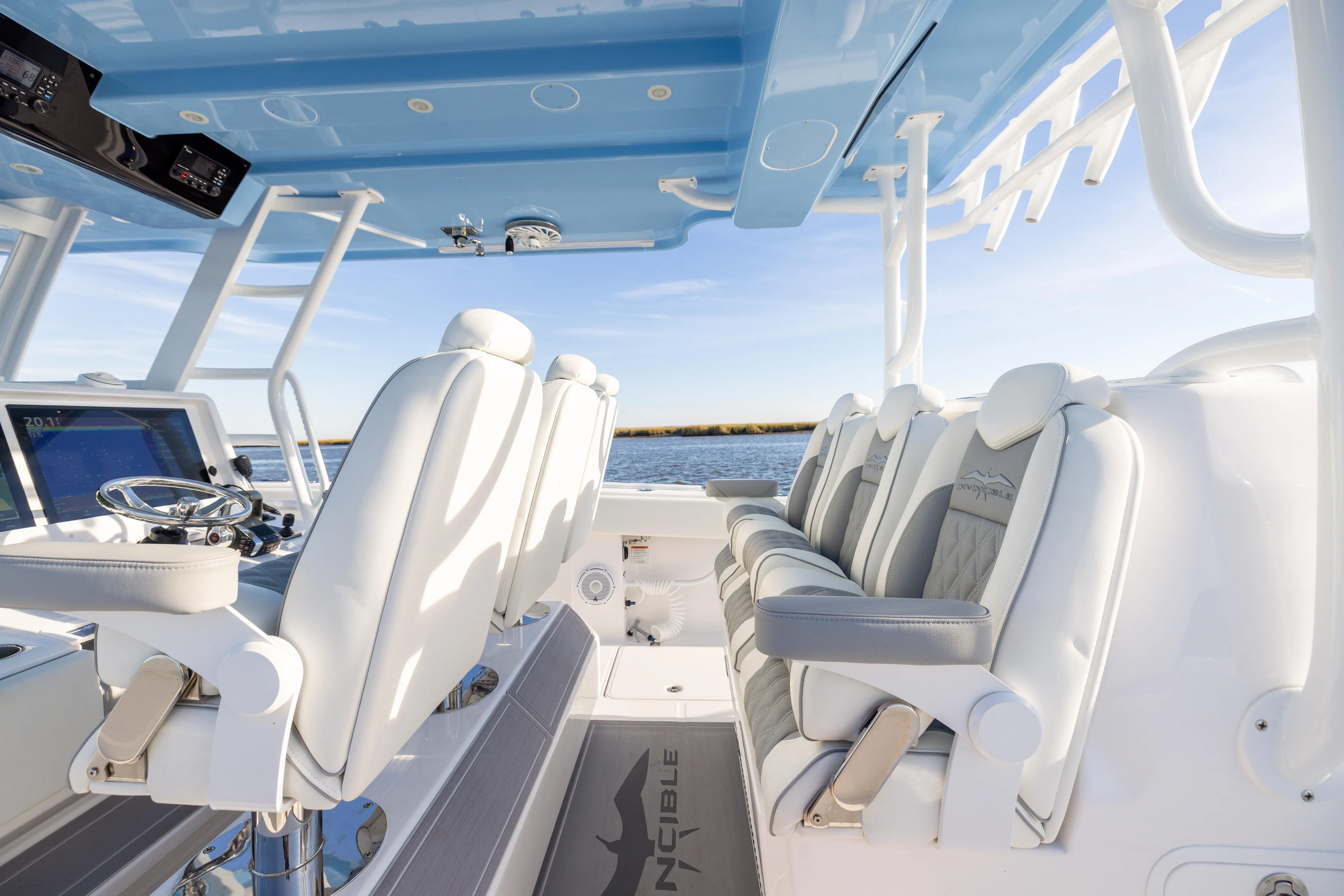  Yacht Photos Pics 2024 Invincible 40 Catamaran interior with luxurious seating and modern helm design.
