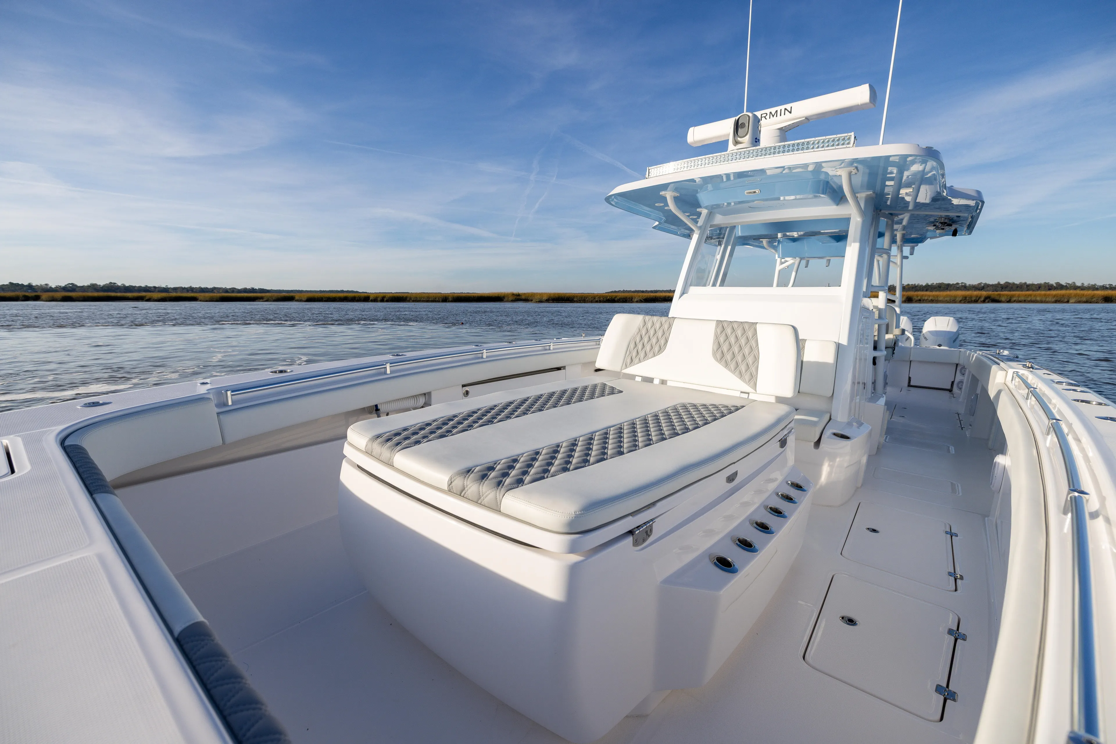  Yacht Photos Pics 2024 Invincible 40 Catamaran on calm water, showcasing luxurious seating and sleek design.