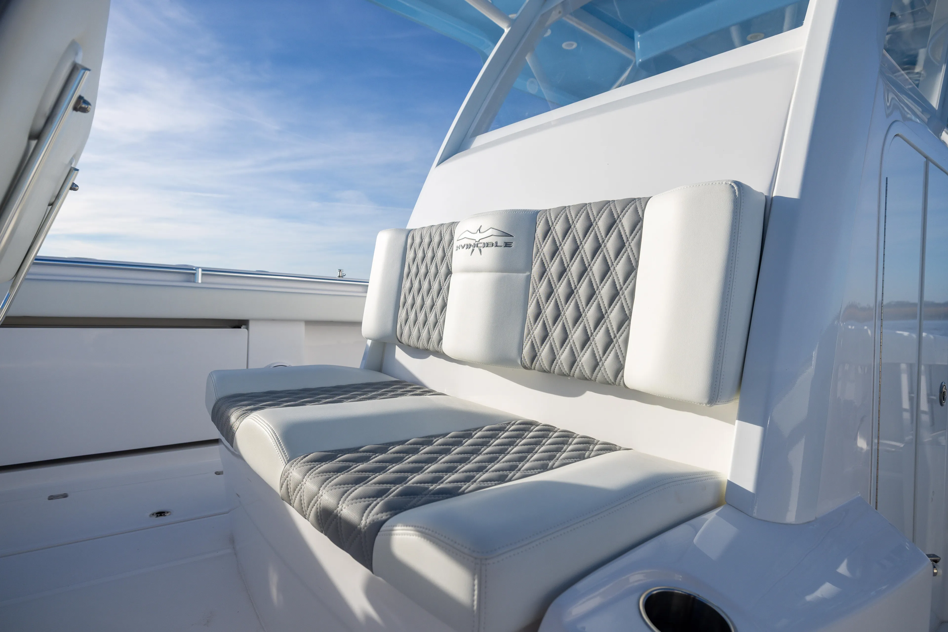  Yacht Photos Pics Luxurious seating on 2024 Invincible 40 Catamaran, featuring diamond-stitched upholstery.