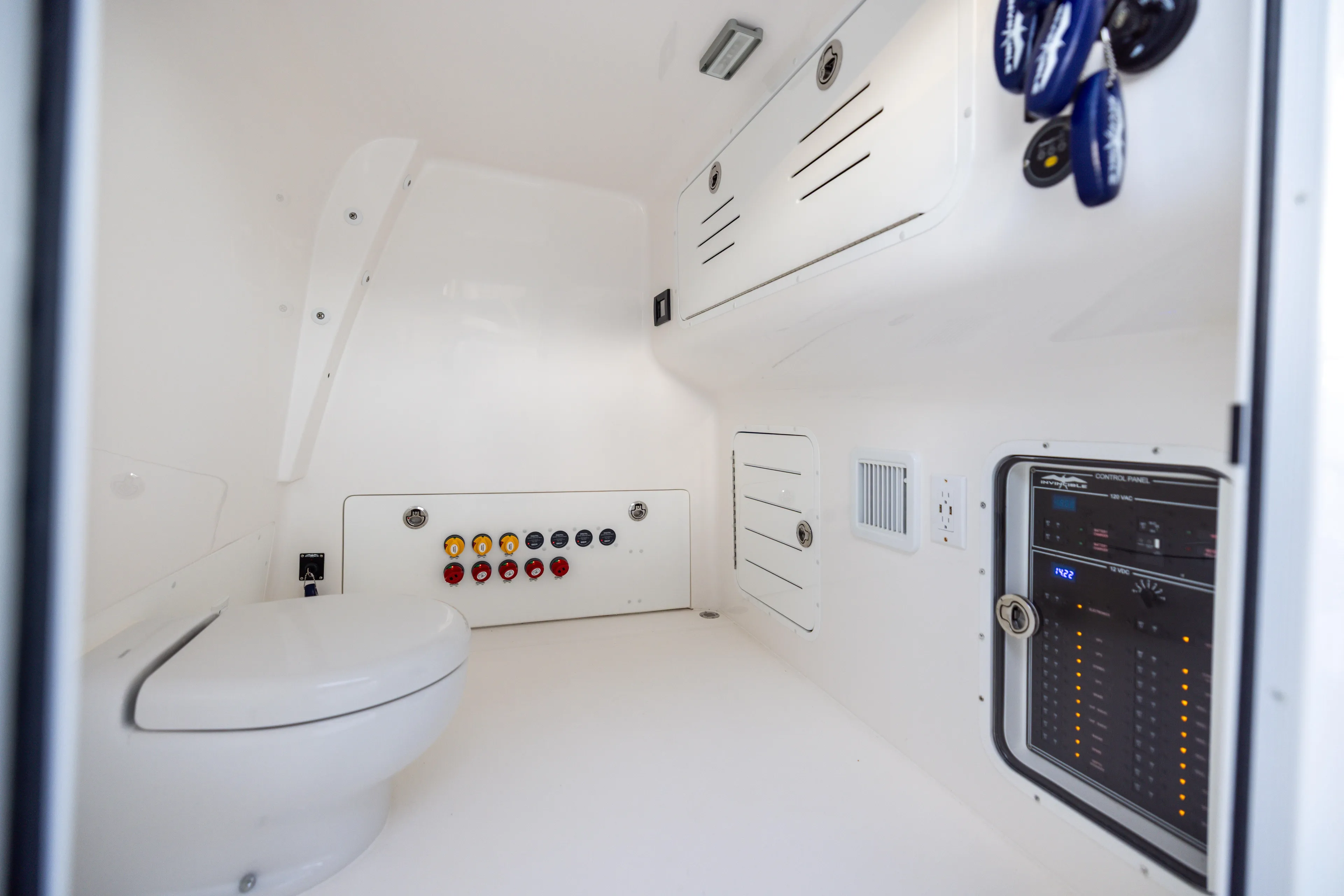  Yacht Photos Pics Interior of 2024 Invincible 40 Catamaran featuring control panel and modern amenities.