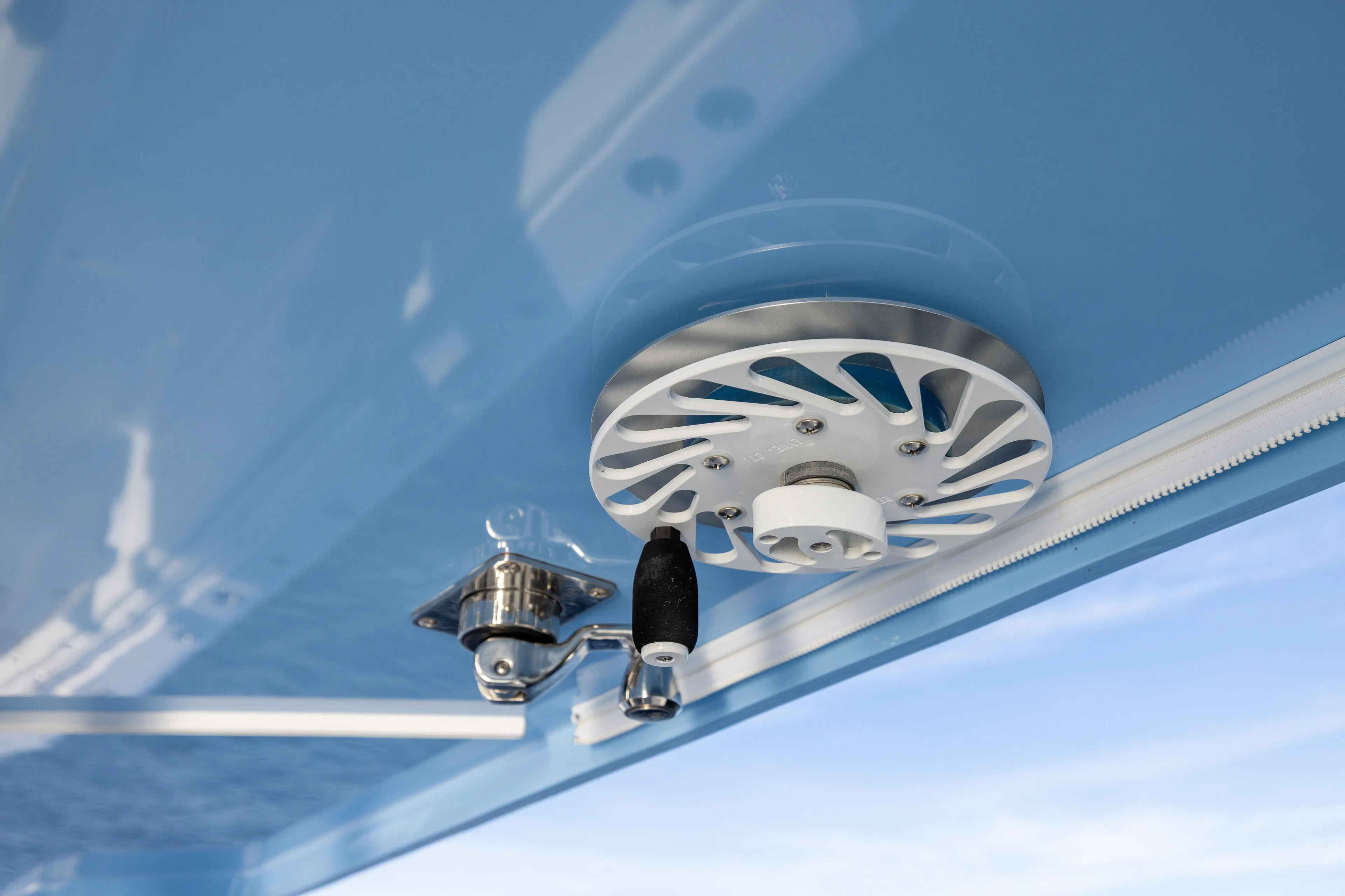  Yacht Photos Pics Close-up of 2024 Invincible 40 Catamaran's ceiling mechanism against blue sky.
