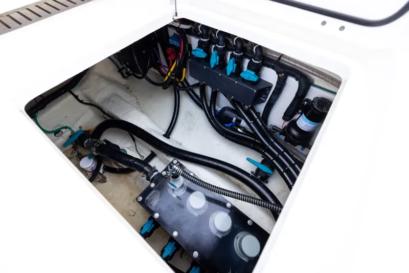  Yacht Photos Pics Engine compartment of 2024 Invincible 40 Catamaran, showcasing wiring and components.