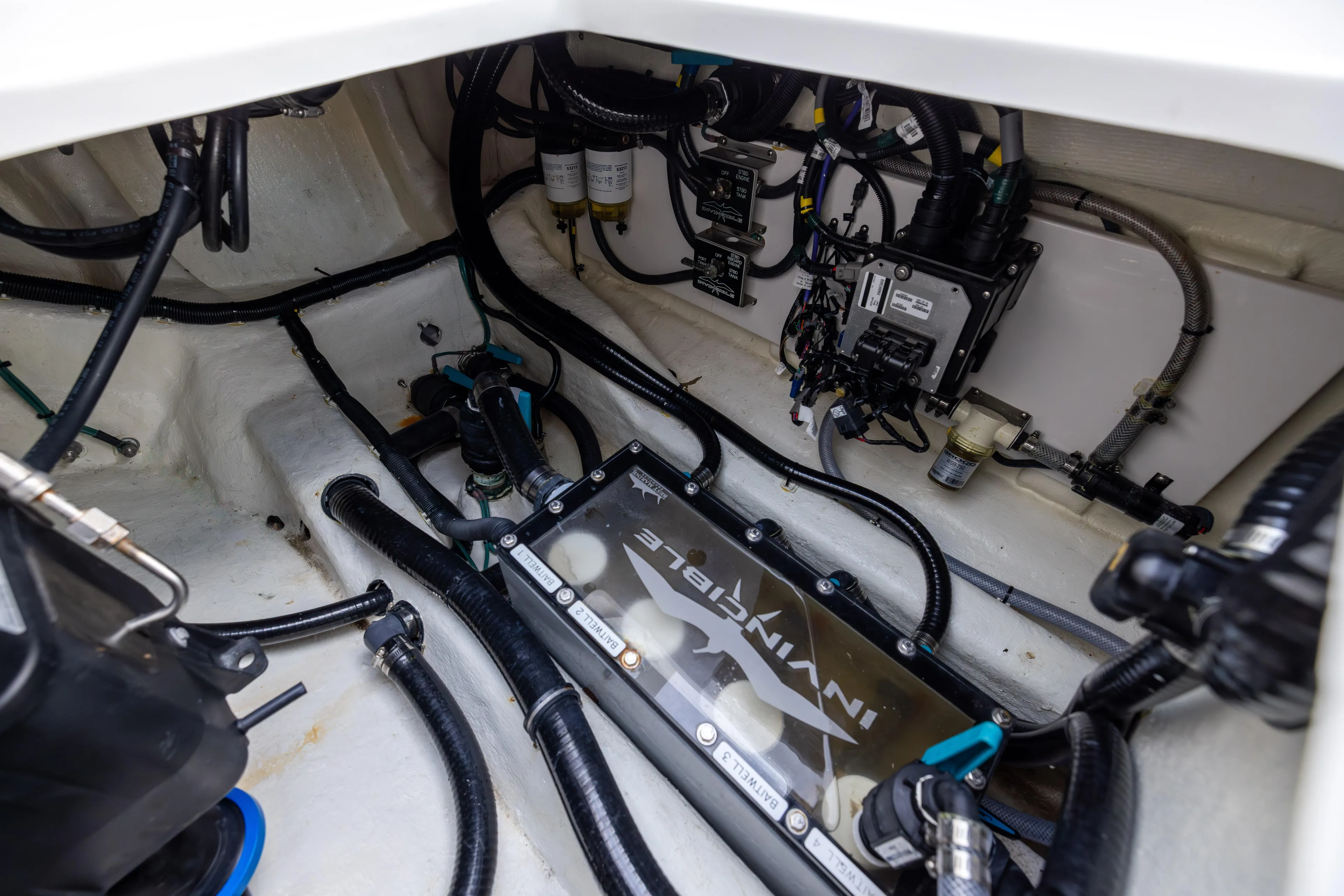  Yacht Photos Pics Engine compartment of 2024 Invincible 40 Catamaran, showcasing wiring and components.