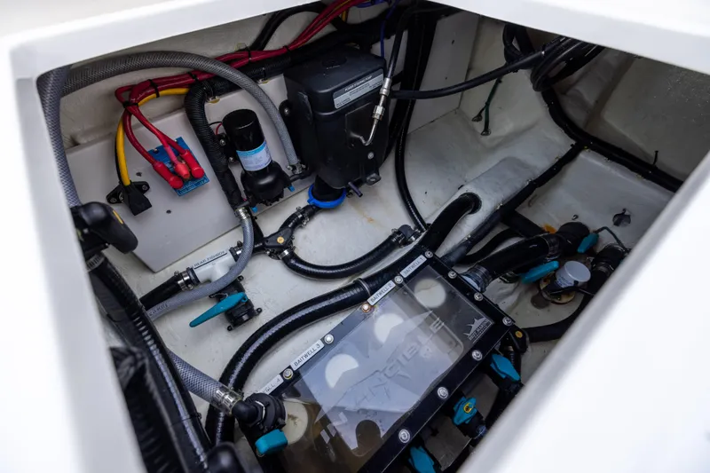  Yacht Photos Pics Engine compartment of 2024 Invincible 40 Catamaran showcasing wiring and components.