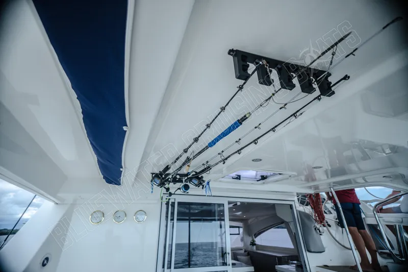 Purple Pearl Yacht Photos Pics 2015 Leopard 48 yacht interior with fishing rods mounted on the ceiling.
