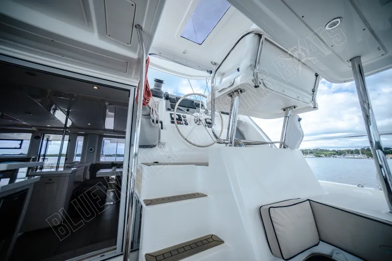Purple Pearl Yacht Photos Pics Interior view of a 2015 Leopard 48 yacht, showcasing helm and seating area.