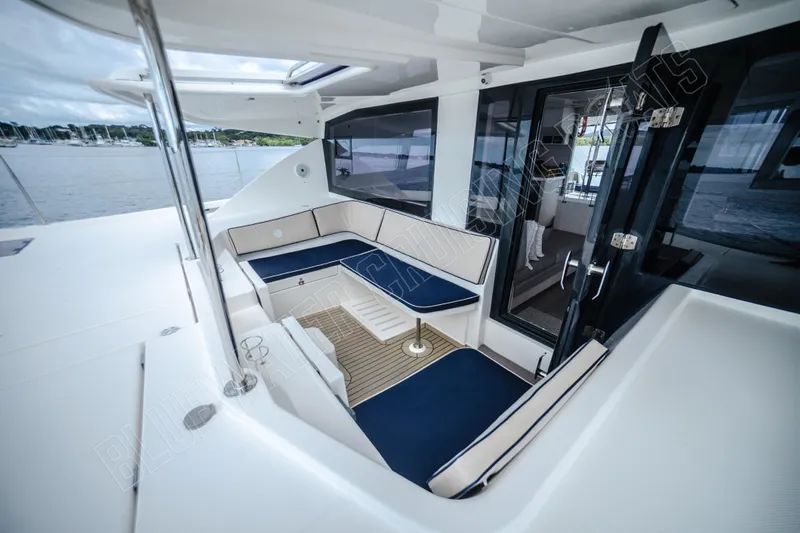 Purple Pearl Yacht Photos Pics Luxurious 2015 Leopard 48 yacht interior with elegant seating and scenic water view.