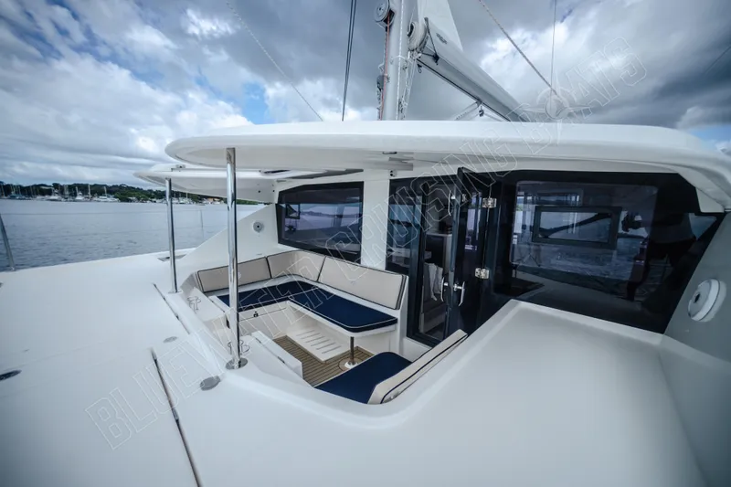 Purple Pearl Yacht Photos Pics Luxurious 2015 Leopard 48 yacht deck with seating area under cloudy sky.