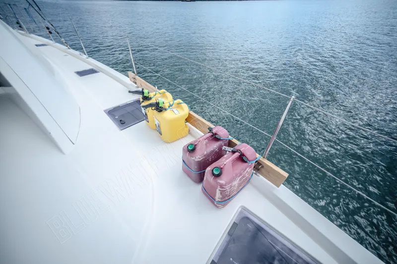 Purple Pearl Yacht Photos Pics Deck of 2015 Leopard 48 yacht with fuel containers, overlooking the ocean.