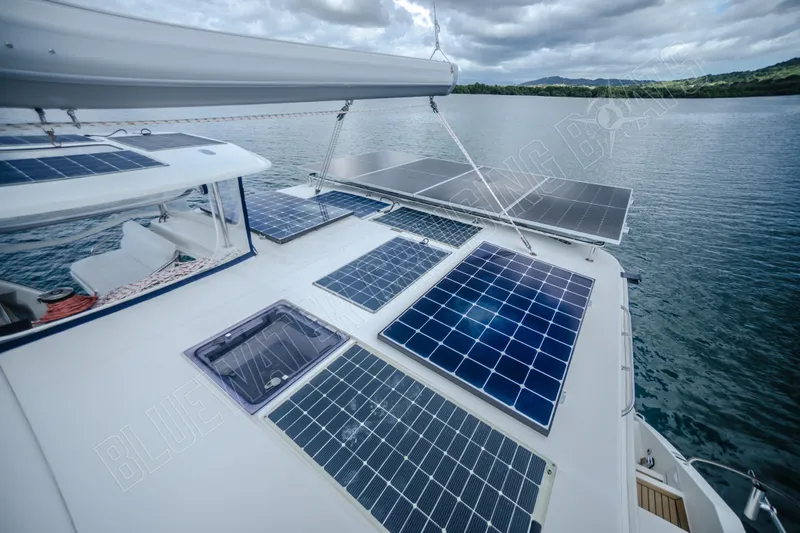 Purple Pearl Yacht Photos Pics Solar panels on a 2015 Leopard 48 catamaran, sailing on a calm lake.