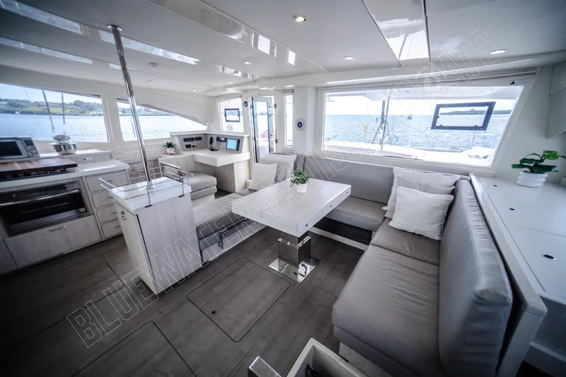 Purple Pearl Yacht Photos Pics Luxurious interior of 2015 Leopard 48 yacht with modern kitchen and seating area.