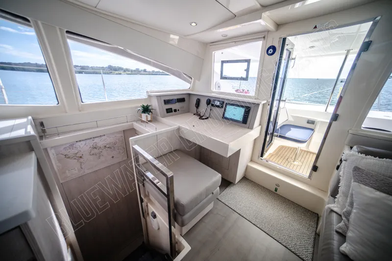 Purple Pearl Yacht Photos Pics Interior of 2015 Leopard 48 yacht with navigation station and ocean view.