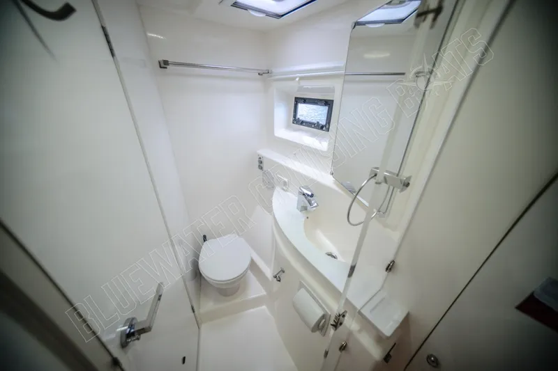 Purple Pearl Yacht Photos Pics Bathroom interior of 2015 Leopard 48 yacht, featuring modern fixtures and compact design.