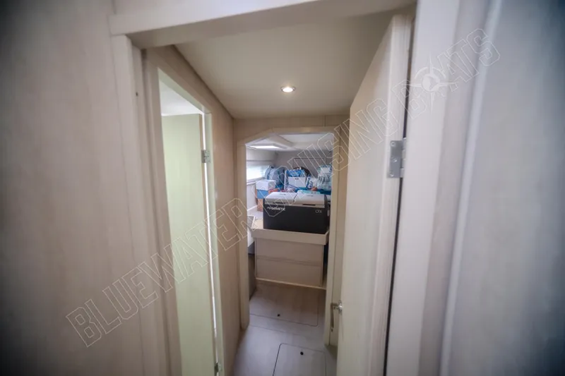 Purple Pearl Yacht Photos Pics Interior view of a 2015 Leopard 48 yacht cabin hallway.