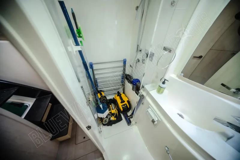 Purple Pearl Yacht Photos Pics Storage area in a 2015 Leopard 48 yacht with cleaning supplies and tools.