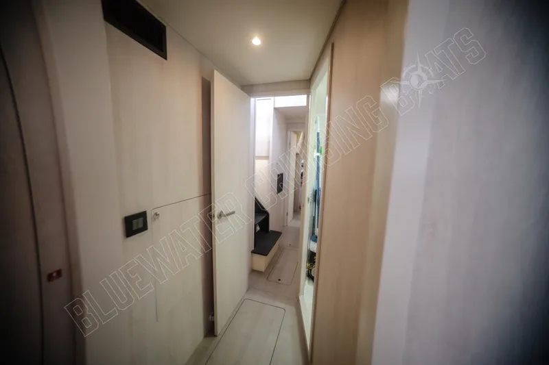 Purple Pearl Yacht Photos Pics Interior hallway of a 2015 Leopard 48 yacht, featuring modern design and lighting.