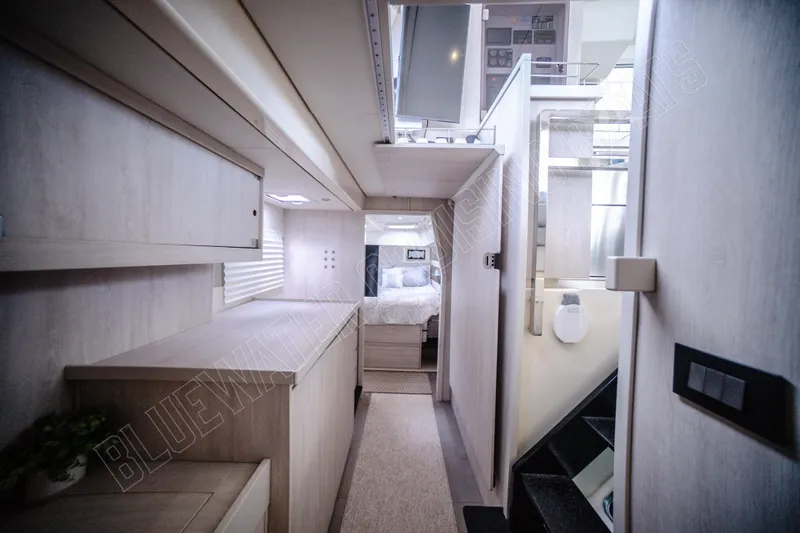 Purple Pearl Yacht Photos Pics Luxurious interior of a 2015 Leopard 48 yacht, featuring modern design and cozy bedroom.