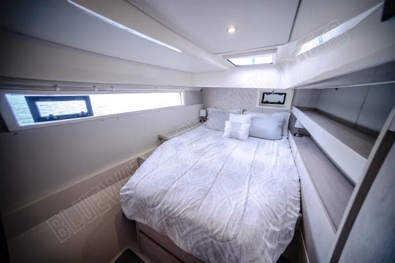 Purple Pearl Yacht Photos Pics Luxurious cabin interior of 2015 Leopard 48 yacht with cozy bed and modern design.