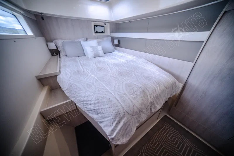 Purple Pearl Yacht Photos Pics Luxurious cabin interior of 2015 Leopard 48 yacht with cozy bedding.
