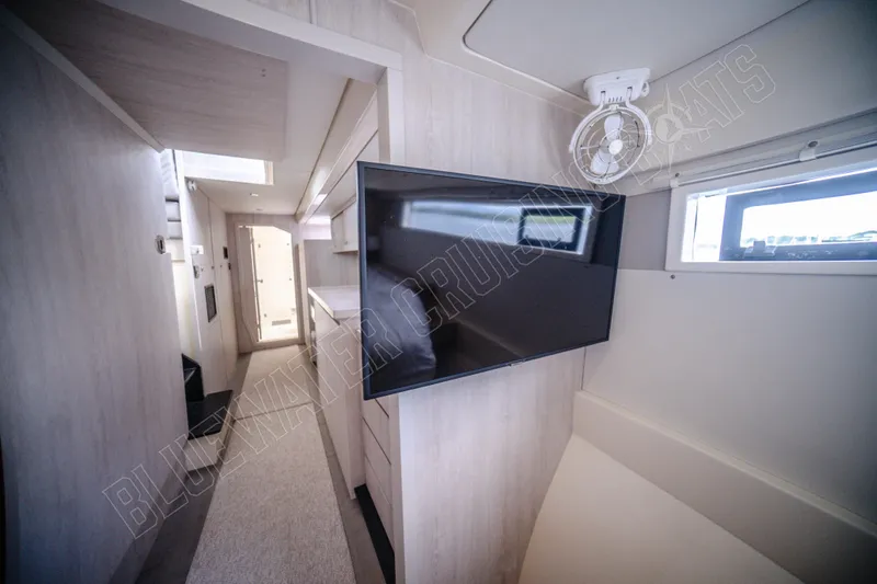 Purple Pearl Yacht Photos Pics Interior of 2015 Leopard 48 yacht with modern design and wall-mounted TV.
