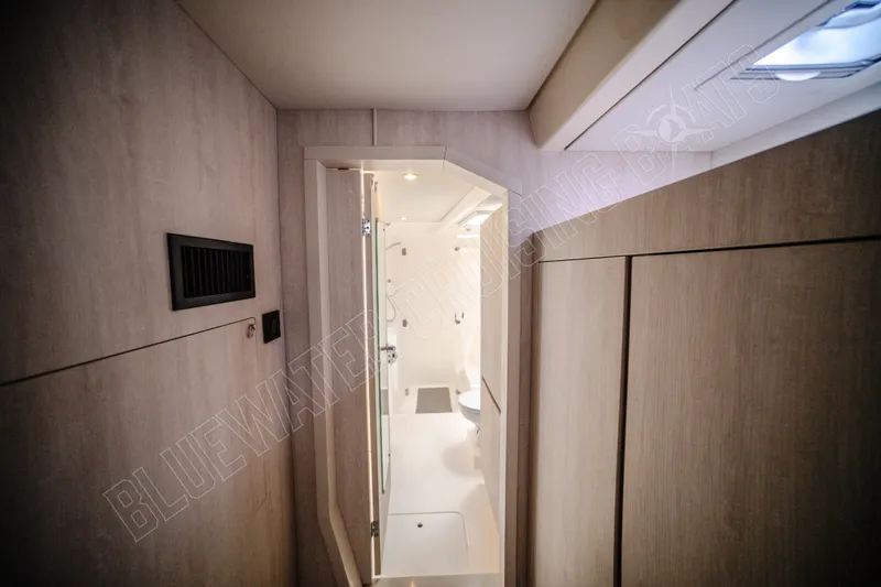 Purple Pearl Yacht Photos Pics Interior of 2015 Leopard 48 yacht, featuring modern bathroom design and wood paneling.