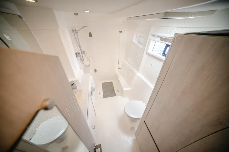 Purple Pearl Yacht Photos Pics Modern bathroom interior on 2015 Leopard 48 yacht, featuring shower and toilet.