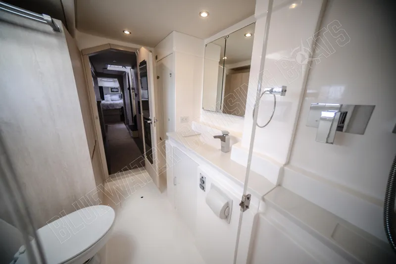 Purple Pearl Yacht Photos Pics Luxurious bathroom interior of 2015 Leopard 48 yacht, featuring modern fixtures and spacious design.