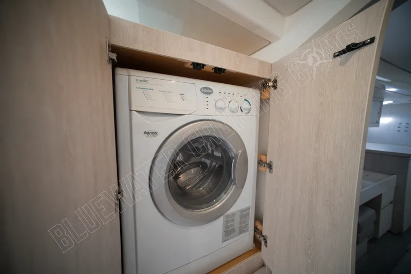Purple Pearl Yacht Photos Pics Washing machine in Leopard 48 yacht, 2015 model, inside wooden cabinet.
