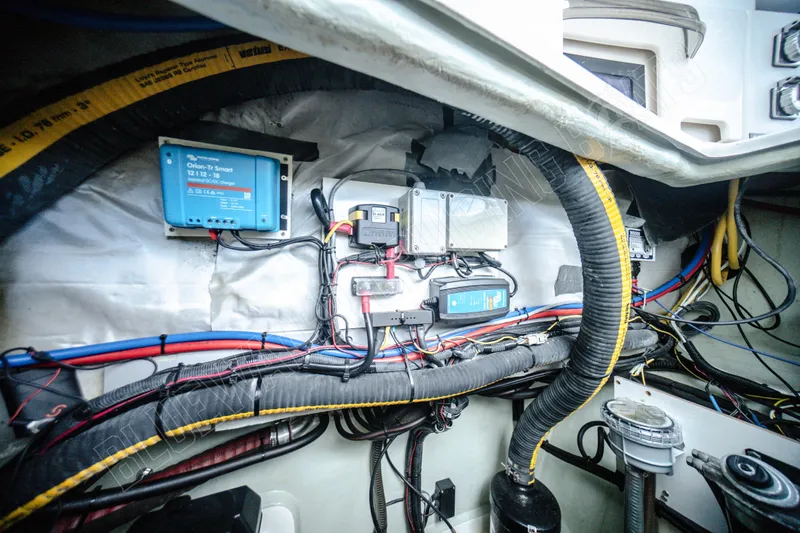 Purple Pearl Yacht Photos Pics Electrical system inside a 2015 Leopard 48 yacht, showcasing wiring and components.