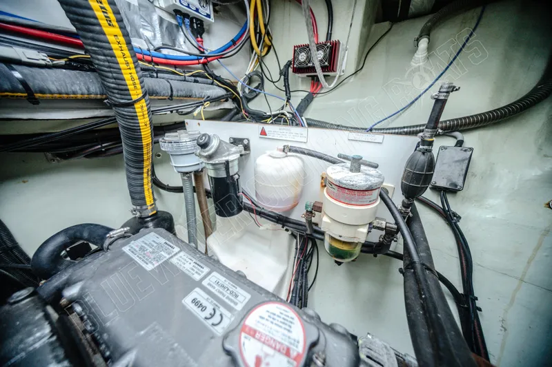 Purple Pearl Yacht Photos Pics Engine room of a 2015 Leopard 48 yacht with visible wiring and components.