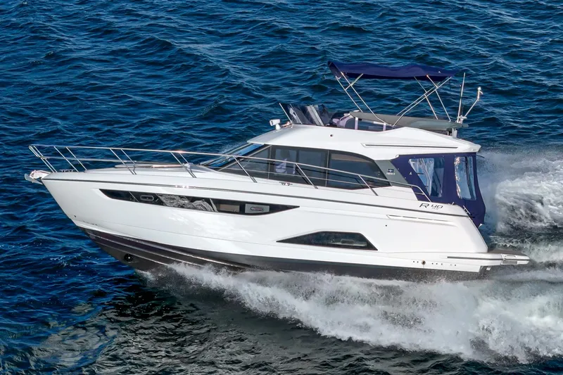  Yacht Photos Pics 2024 Bavaria R40 yacht cruising on open water, showcasing sleek design and luxury features.